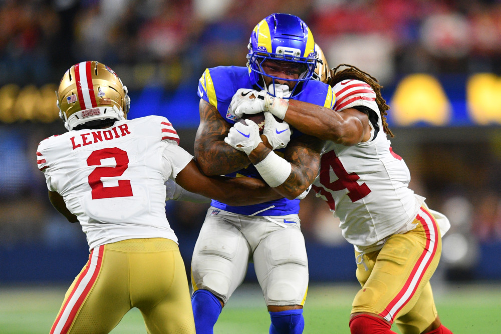 NFL: OCT 02 49ers at Rams - Dynasty Nerds Kyren Williams featured in Week 6 Fantasy Football Player Rankings Tiers Start Sit QB RB WR TE splits two 49ers defenders on his way to a 1st down.